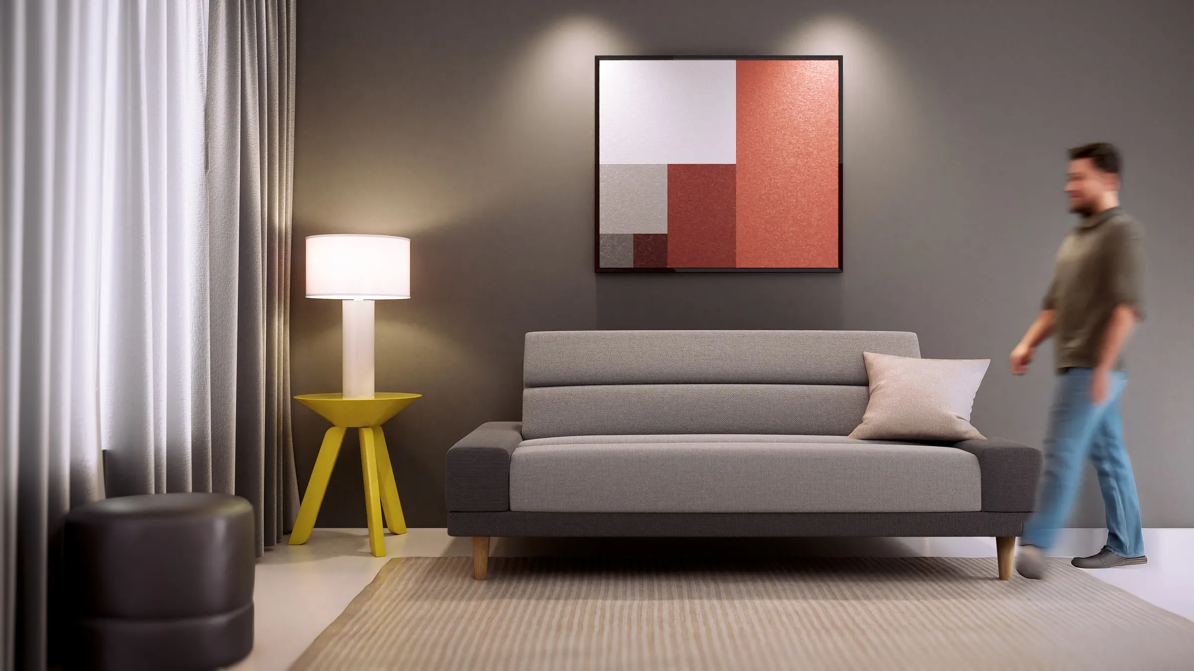 Malmo sofa bed styled in a living room with a person walking past